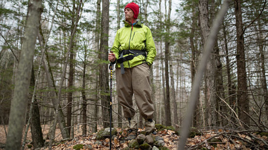 Dave Butler stands atop a stone wall on an early spring hike. (photo © Ben Conant)