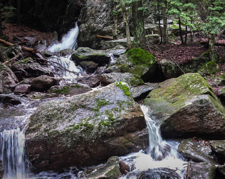 A small waterfall cascading among granite blocks. (photo © Stephen Gehlbach)