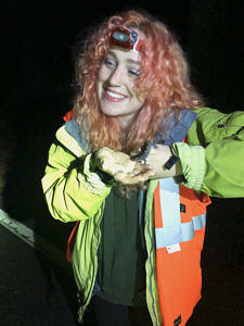 Macie Flammia smiles while holding a spotted salamander. (photo © Karen Seaver)
