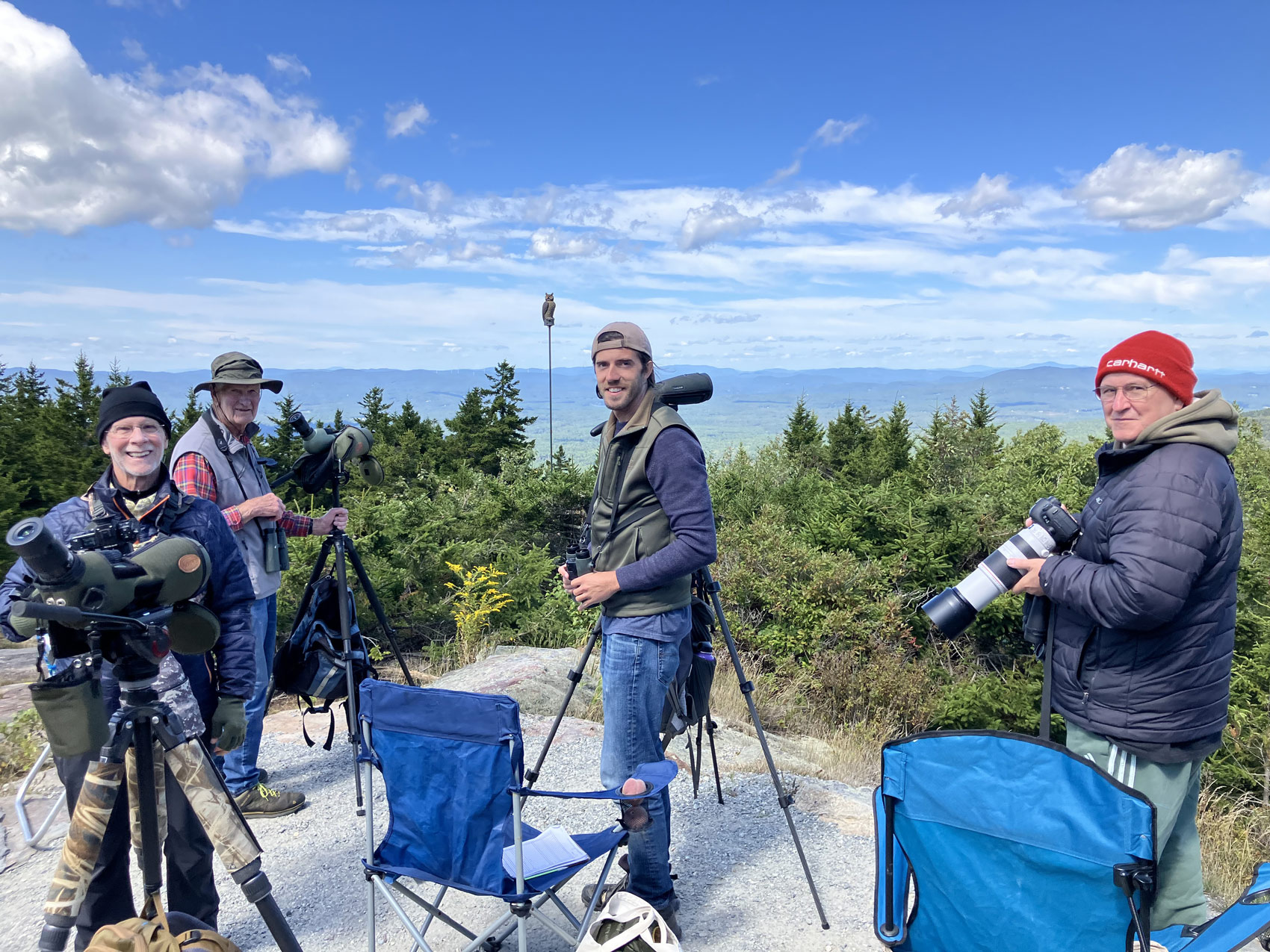 Hawk watchers with cameras and scopes on top of Pack Monadnock (Photo © Phil Brown)
