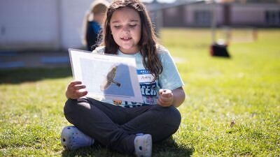 Antrim Elementary student outside at a workshop with Kara Reynolds (photo © Ben Conant)