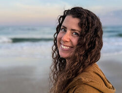 Emma Kluge standing on a beach