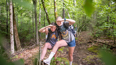 Two girls at summer camp hiking a mountain (photo © Ben Conant)