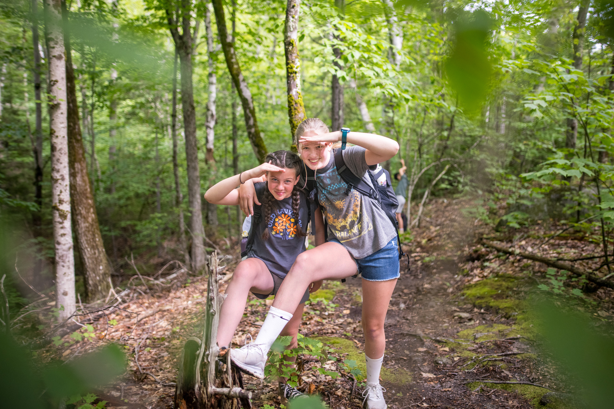 Two girls at summer camp hiking a mountain (photo © Ben Conant)