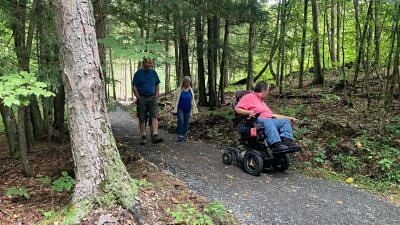 Exploring the Glover's Ledge accessible hiking trail (photo courtesy of Antioch University via Facebook)