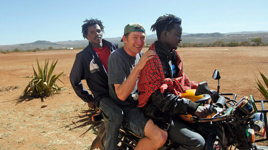 Bill Donahue Among the Maasai in Kenya (photo © Georgina Goodwin)