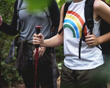 Two people hiking in the woods (photo © Rawpixel)