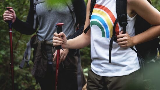 Two people hiking in the woods (photo © Rawpixel)