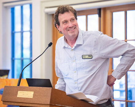 Jeremy Wilson speaking at the 2025 Annual Meeting (photo © Ben Conant)
