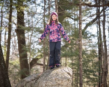 Girl stands on a boulder (photo © Ben Conant)