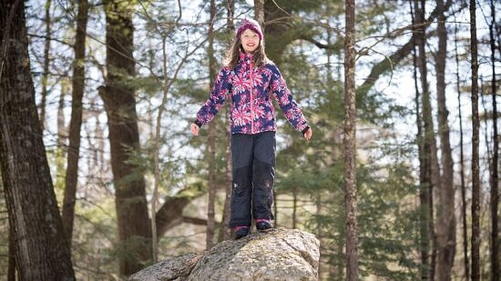 Girl stands on a boulder (photo © Ben Conant)