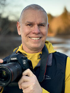 Matt Mattus holding a camera (courtesy photo)