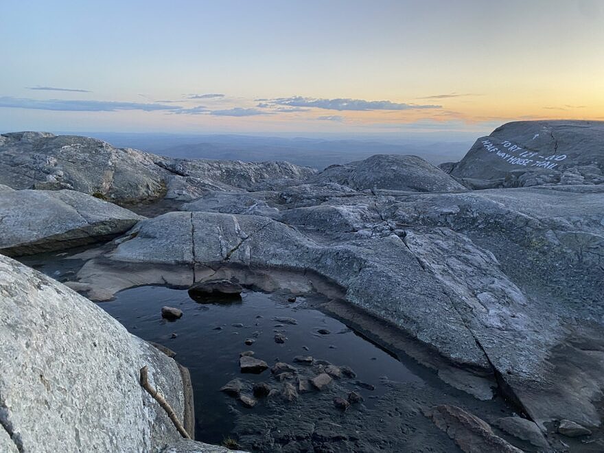 Sunset over a vernal pool on the summit of Mount Monadnock. (photo © Emma Kluge)