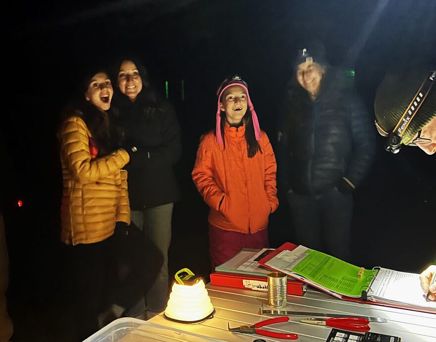The face people make when they see a saw-whet owl for the very first time at a banding demonstration! (photo © Brett Amy Thelen)