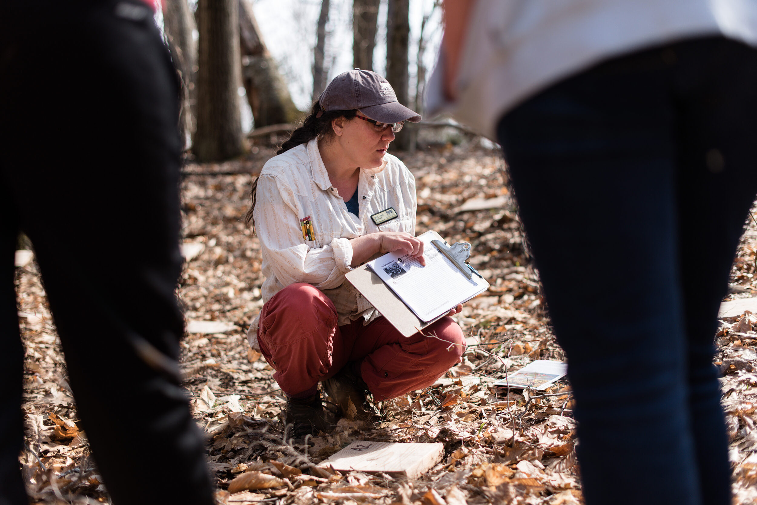 Brett Amy Thelen explains data collection during a coverboard survey (photo © Ben Conant)