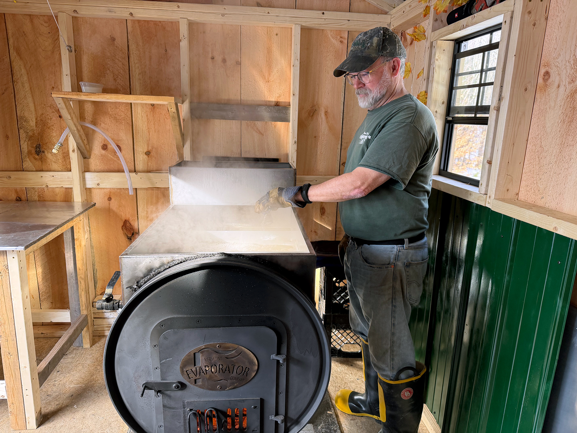 Eric Aldrich boils sap in his sugar house in Hancock, NH. (photo © Susie Spikol)
