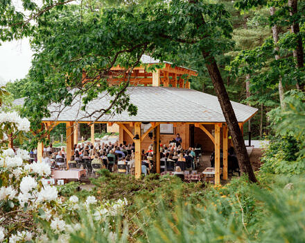 Guests gather at the Open Lodge (photo © Oriana Camara)