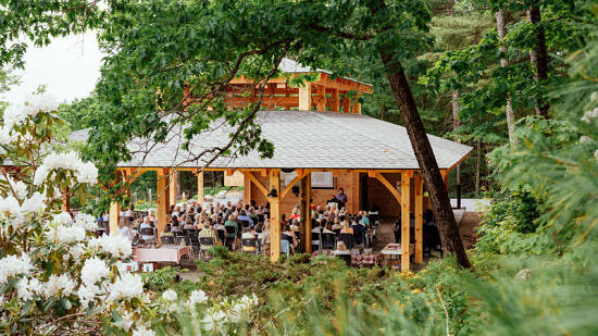 Guests gather at the Open Lodge (photo © Oriana Camara)