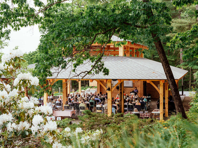 Guests gather at the Eleanor Briggs Open Lodge. (photo © Oriana Camara)