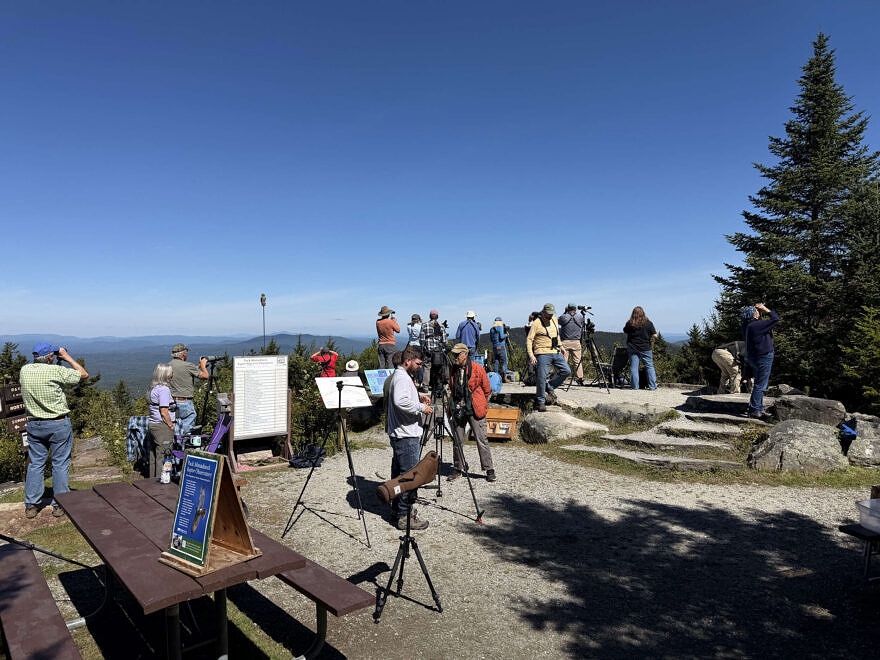 Meade Cadot talks with WMUR TV crew during a day of hawkwatching on Pack Monadnock. (photo © Phil Brown)