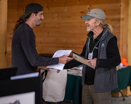 Nate Marchessault presenting the Laurie Bryan Partnership Award to Michael Nerrie (photo © Ben Conant)